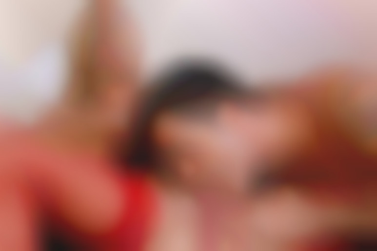 A blond Bimbo girl with big tits riding hard with a big cock in sexy red lingery