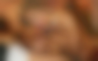 A blond girl with big boobs gets a hard fuck on the table at a cigar club