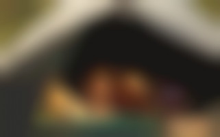 Passionate travellers engage in tent sex at the campsite